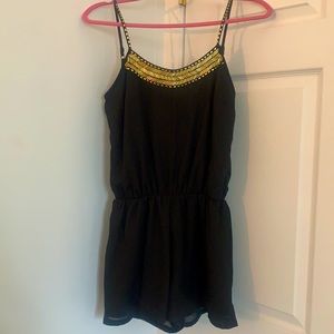 Black Romper with Gold Accents